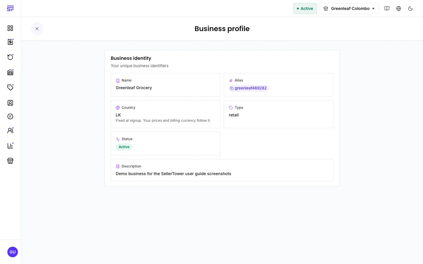 The Business profile page: a Business identity card with tiles for Name, Alias (with a copy chip), Country (noting 'Fixed at signup. Your prices and billing currency follow it.'), Type, an Active status pill, and Description.